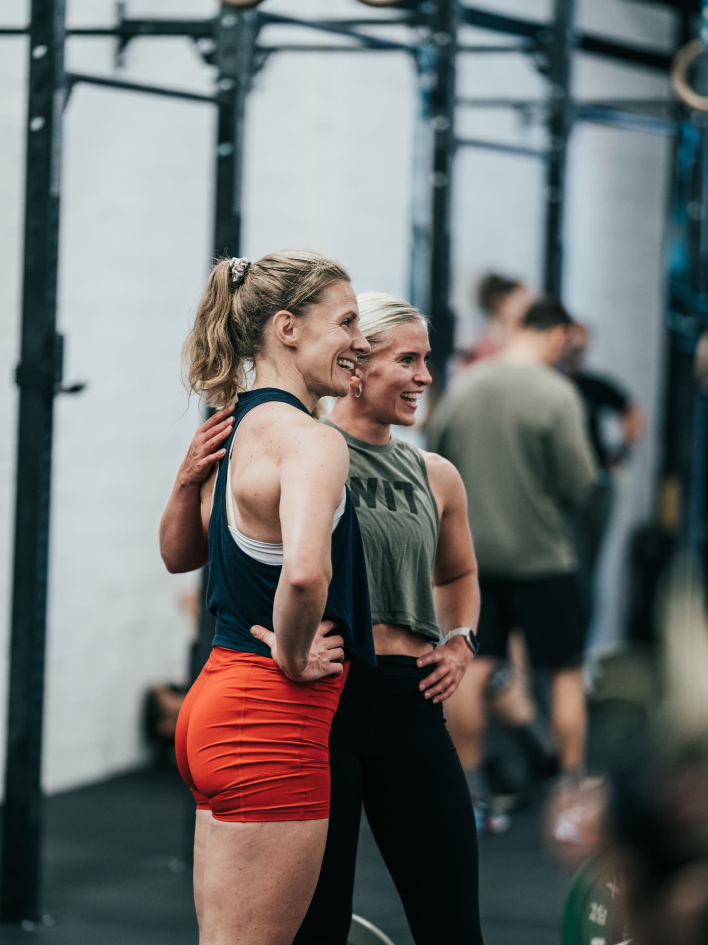 Members sitting and laughing after a class at Grand Union CrossFit